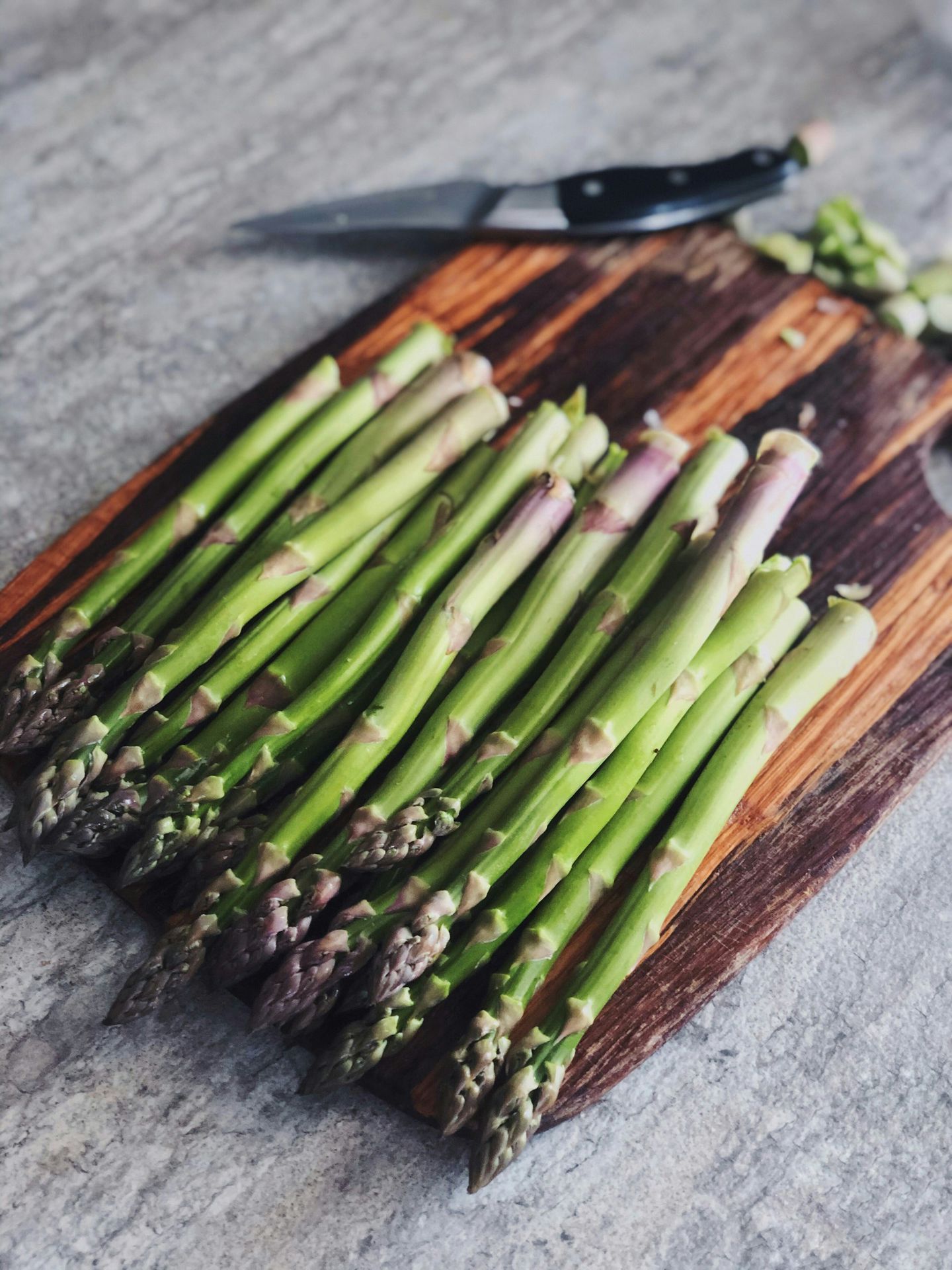 green and brown vegetable on brown wooden chopping board