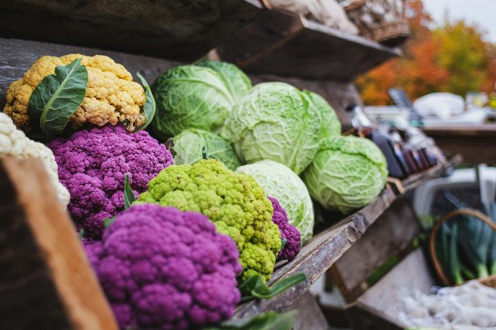 a variety of vegetables are on display at a market